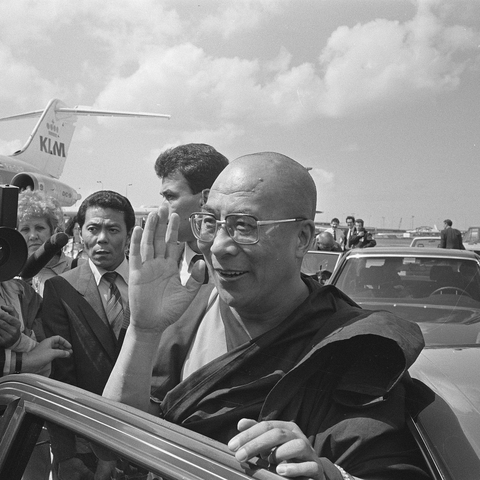 The Dalai Lama waves to a crowd during a visit to the Netherlands in the 1980s.