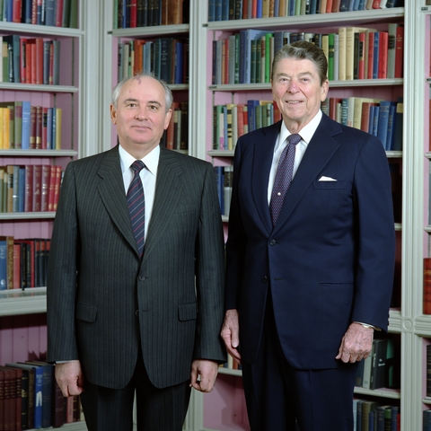 Mikhail Gorbachev and President Ronald Reagan posing for a photograph in the White House Library.