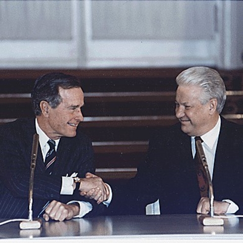 President George H.W. Bush shaking hands with Russian President Boris Yeltsin at the Kremlin.