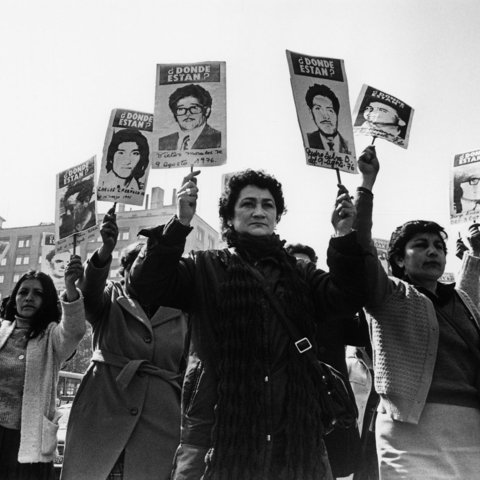 Women of the Association of Families of the Detained-Disappeared demonstrate in front of La Moneda Palace during the Pinochet military regime.