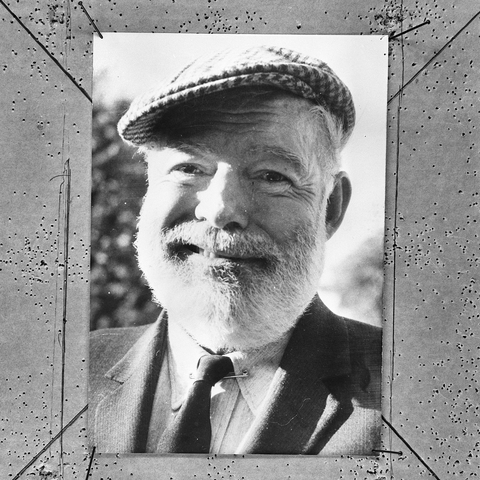 Photo of Ernest Hemingway smiling.