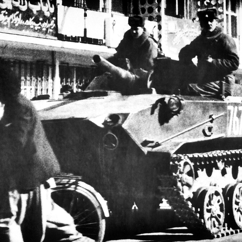 Soviet soldiers riding on a combat vehicle in Kabul, Afghanistan in 1986.