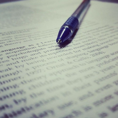 Stock photo of a pen on paper.