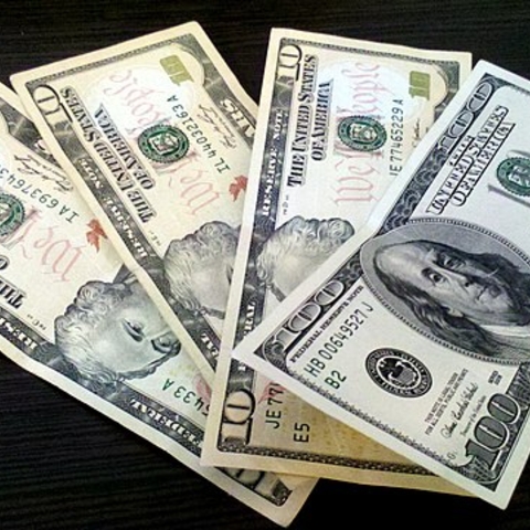 100 and 10 US dollars banknotes.