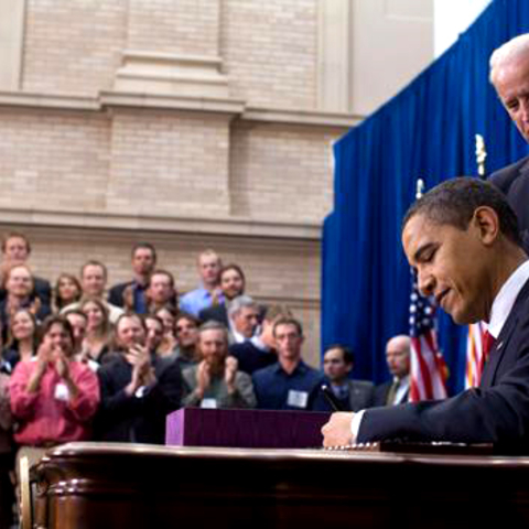 President Barack Obama signed the ARRA into law on February 17, 2009. Vice President Joe Biden stood directly behind him.