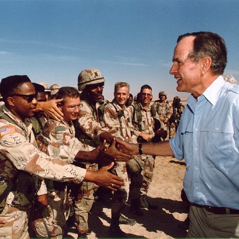 President Bush visiting American troops in Saudi Arabia on Thanksgiving Day, 1990.