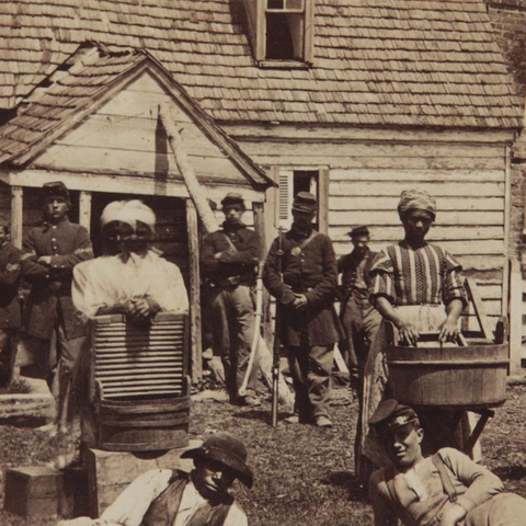Contrabands—fugitive slaves—cooks, laundresses, laborers, teamsters, railroad repair crews—fled to the Union Army, but were not officially freed until 1863 by the Emancipation Proclamation.