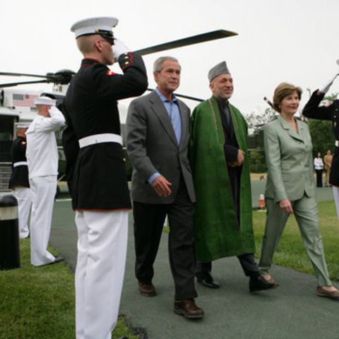 Karzai with former US President George W. Bush and wife Laura Bush at Camp David in 2007.