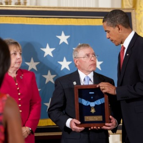 Monti's parents receive his Medal of Honor from President Barack Obama during a ceremony in the White House, September 17, 2009.