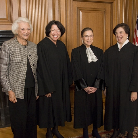The four women Supreme Court Justices: Sandra Day O'Connor, Sotomayor, Ruth Bader Ginsburg, and Elena Kagan. O'Connor is not wearing a robe because she is retired from the Court.