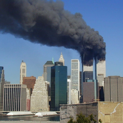 Plumes of smoke billow from the World Trade Center towers in Lower Manhattan, New York City, after a Boeing 767 hits each tower during the September 11 attacks.