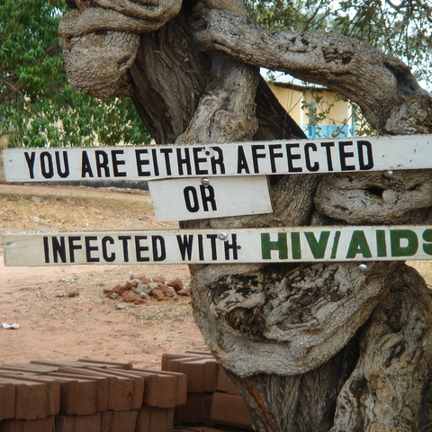 sign reading You are either affected or infected with HIV/AIDS in Zambia