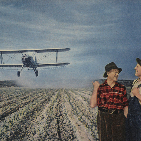 advertisement with bi-plane dusting over a field and two farmers talking about it