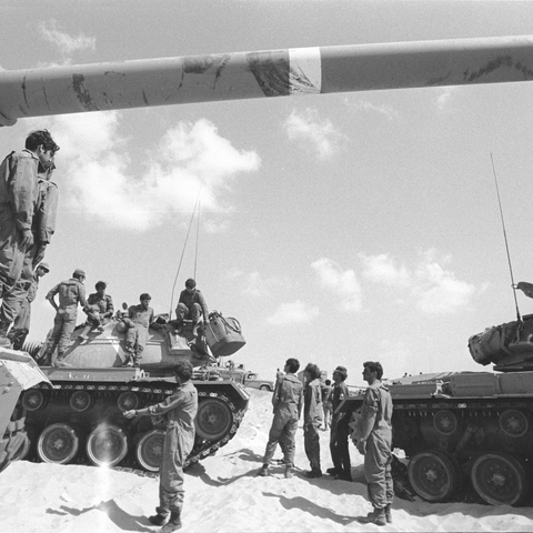 Israeli soldiers stand around their tanks during the Yom Kippur War.