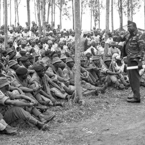 Idi Amin addresses troops during a visit to border regions
