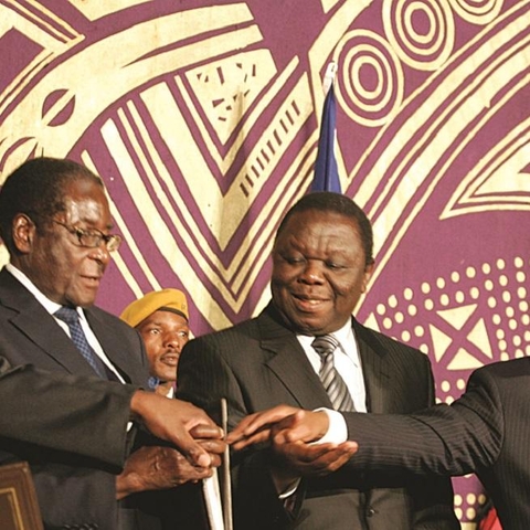 Government of National Unity in 2009. Left to right: Arthur Mutambara, Robert Mugabe, Morgan Tsvangirai, and Thabo Mbeki.