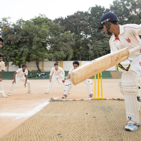 A group of boys at Chirec International School in India playing Cricket, 2015.