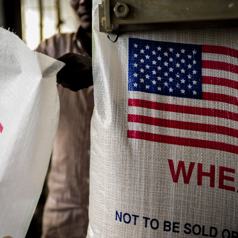 Djiboutian workers fill bags with wheat destined for Ethiopia, provided by the United States Agency for International Development (USAID), at the Port of Djibouti, Africa, Jan. 7, 2013. 