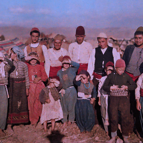 A group of Turkish refugees from 1913 standing in a group outside