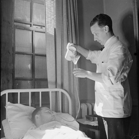 A nurse administering glucose to a patient receiving Insulin Shock Therapy in an Essex, England hospital in 1943.