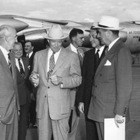 President Dwight D. Eisenhower chatting with members of his cabinet.