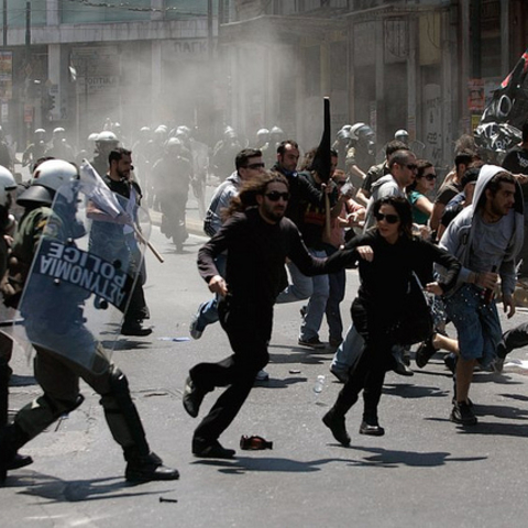 Greek riot police and protesters angered by austerity measures clashing during May Day demonstrations.