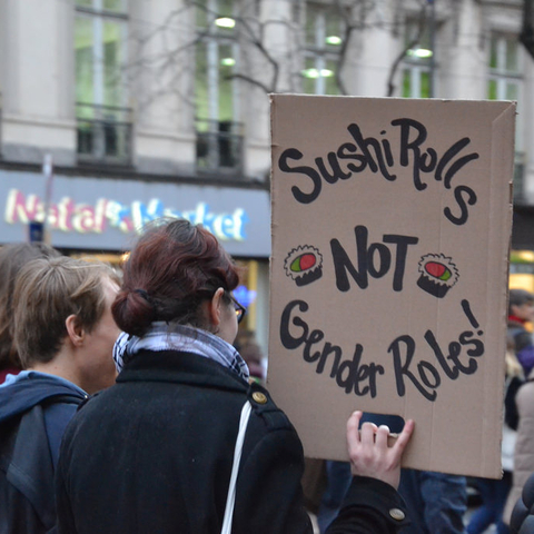 A protester’s sign mocks the notion of prescribed gender roles at a demonstration in Paris, France.
