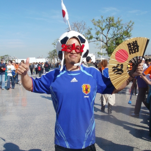 A Japanese Soccer Fan, preparing for the Japanese Team to play the Netherlands Team