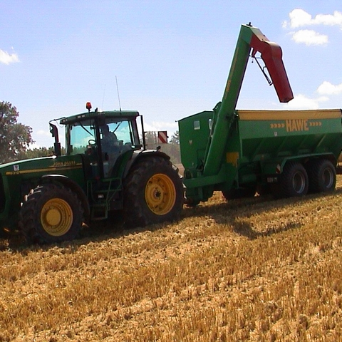 A John Deere tractor at harvest