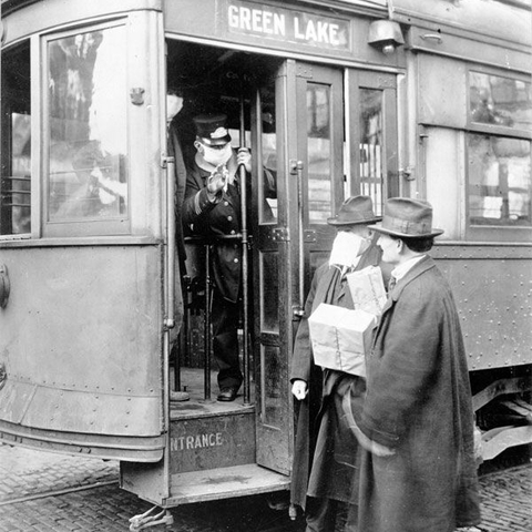 Street car conductor in Seattle not allowing passengers aboard without a mask, 1918