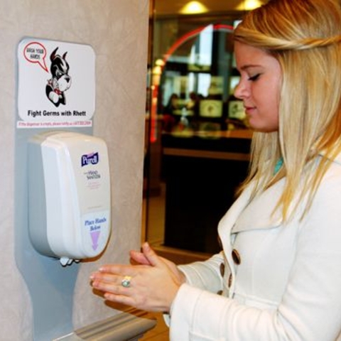A student using waterless hand sanitizer at Boston University during the swine flu pandemic, 2009