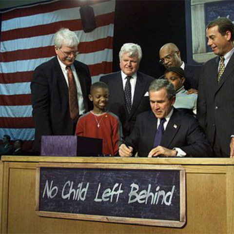President George W. Bush signs "No Child Left Behind" into law in 2002.