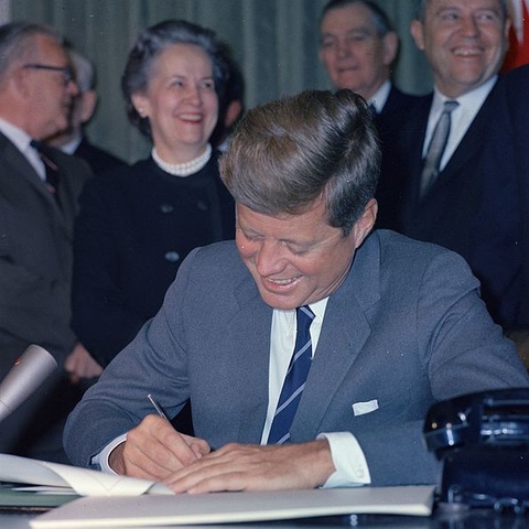 President John F. Kennedy signing the Mental Retardation Facilities and Community Mental Health Center Construction Act.