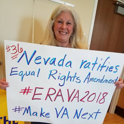 A woman celebrating Nevada’s passage of the Equal Rights Amendment and pledging that Virginia would do so next.