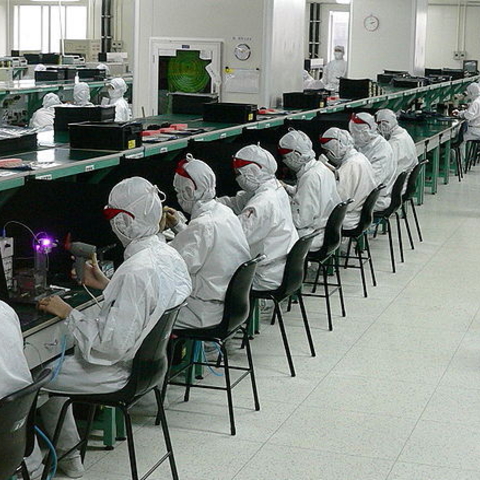 Workers at electronics factories in Guangdong Province.