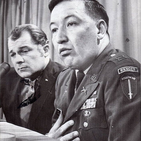 Captain Ernest Medina speaking with reporters after a Pentagon investigation.