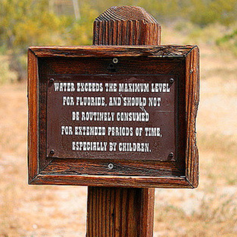 A sign near Morongo Valley, CA warning that the water exceeds the maximum level for fluoride.