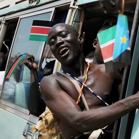 A triumph of modern, or second-generation, U.N. peacekeeping: Members of the Sudan Peoples' Liberation Movement (SPLM) arrive at the rally in Juba in July 2011 as South Sudan prepares for its independence.