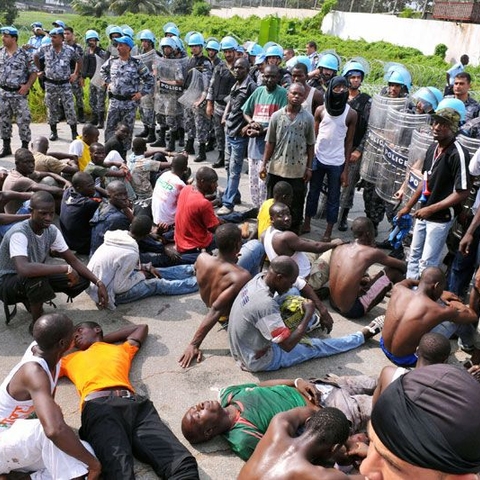 Unrest and violence in spite of a peacekeeping presence: Following disputed November elections in Côte d'Ivoire, many were injured during marches in support of an opposition leader. Here they arrive at U.N. headquarters to receive medical treatment.