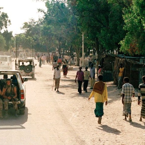 Frustrating efforts at peacekeeping in Somalia have prompted the United Nations to reassess its strategies in the post-Cold War era. Belgian and U.S. members of a peacekeeping contingent patrol Kismayo in April 1993.