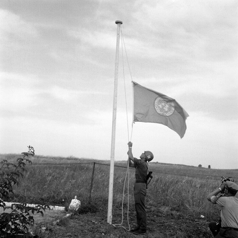 The United Nations flag is lowered at a check post on the Gaza-Tel Aviv road as peacekeepers withdraw on May 19, 1967, after Egypt rescinded its invitation. A few days later, the Six Day War broke out.