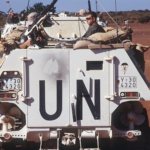 German soldiers in an armored personnel carrier observe the dedication of a well they helped dig in Somalia in 1993 as part of peacekeeping efforts there.