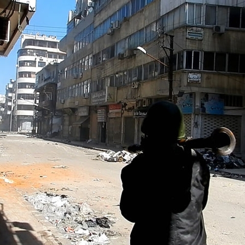 A Free Syrian Army fighter prepares to shot an RPG on the Syrian Army in Homs Source: photo by Bo Yaser