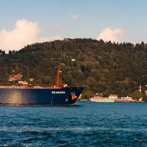 A large ship passing ferries on the Bosporus, a common occurence