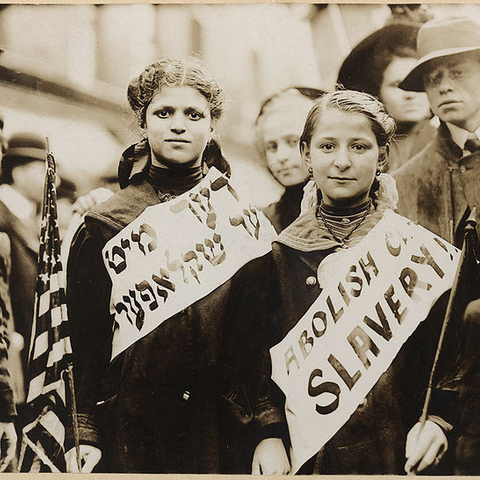 Two girls protest child labor during a 1909 May Day parade in New York City.