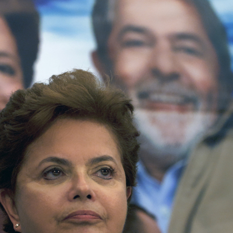 Brazil's President-elect Dilma Rousseff stands before an image of her mentor, President Luiz Inacio Lula da Silva (Lula).