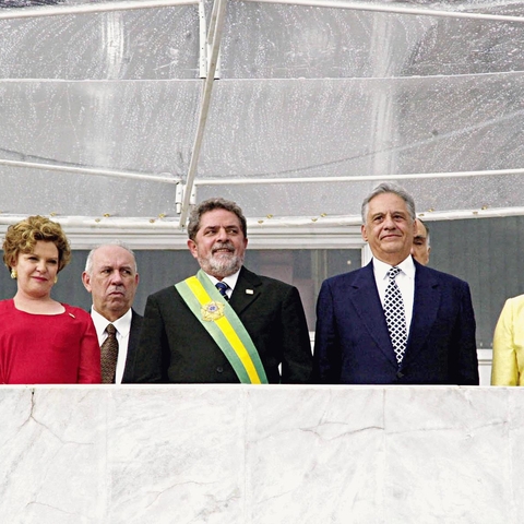 The 2003 inauguration of Brazilian President Luiz Inacio Lula da Silva, with presidential sash, flanked by outgoing President Fernando Henrique Cardoso and both men's wives