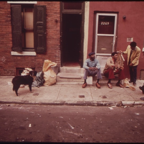 Jobless men in Philadelphia talk with a member of the Urban Coalition, a church-based organization of black community leaders, in 1973.