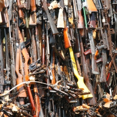 A tower of confiscated smuggled weapons about to be set ablaze in Nairobi, Kenya, in 2007