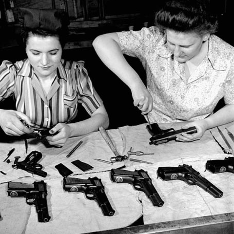 Workers assemble Browning-Inglis Hi-Power pistols at a Canadian munitions plant in 1944.